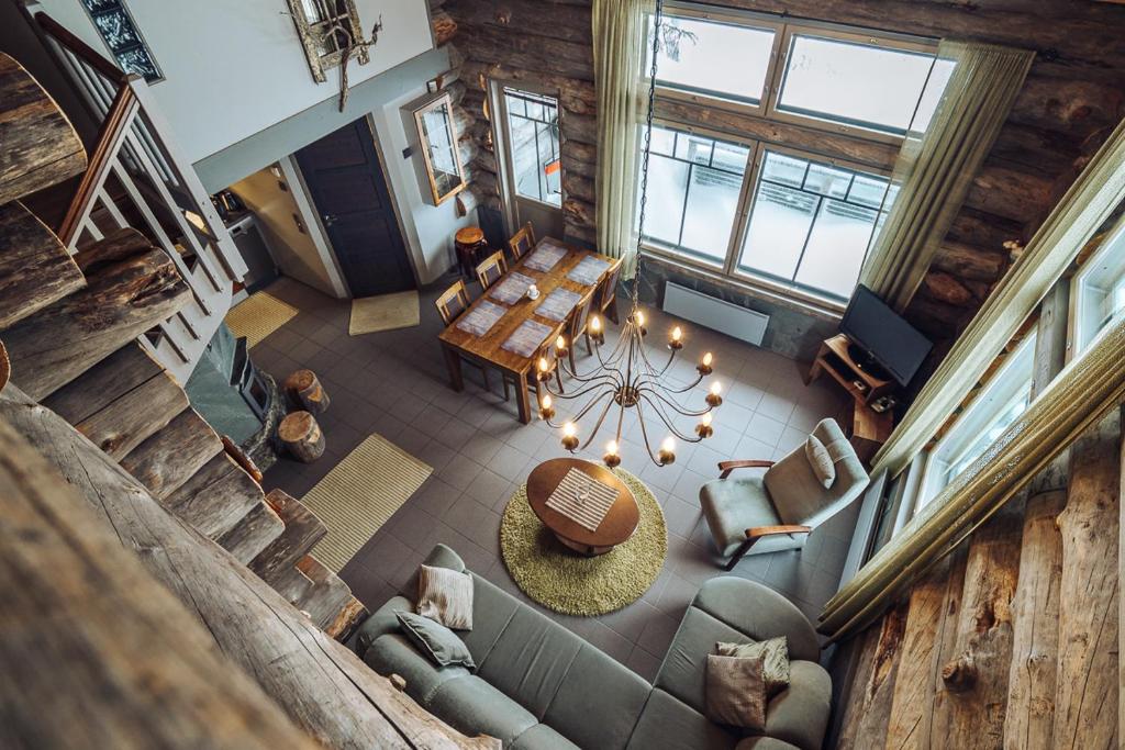 an overhead view of a living room with a table and chairs at Sielikkö Aurora Log Apartments in Saariselka