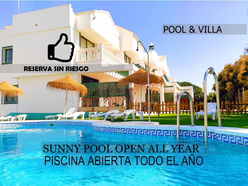 a swimming pool in front of a hotel at Roquetas Beach and Playa Serena Golf Village in Roquetas de Mar