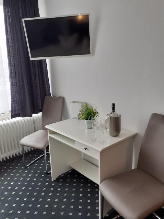 TV a/nebo společenská místnost v ubytování Hotel Promenade