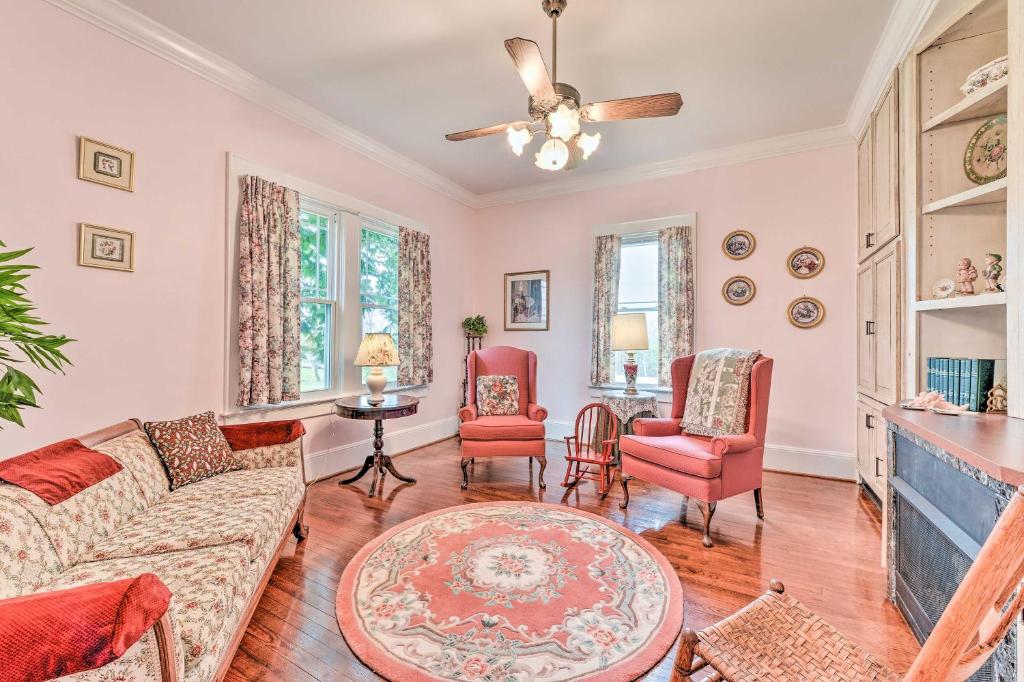 a living room with a couch and chairs and a fireplace at Elegant and Spacious Retreat about 18 Mi to Lake Norman! in Lincolnton