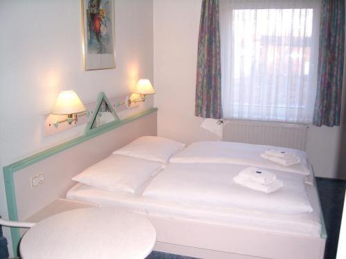 Postel nebo postele na pokoji v ubytování Apart Hotel Leipzig Taucha