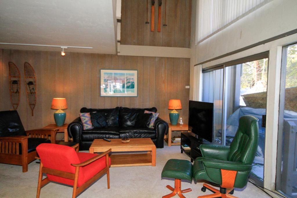 a living room with a couch and chairs at Sierra Park Villas #24 in Mammoth Lakes