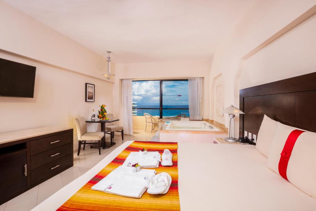 Cama o camas de una habitación en Crown Paradise Club Cancun - All Inclusive