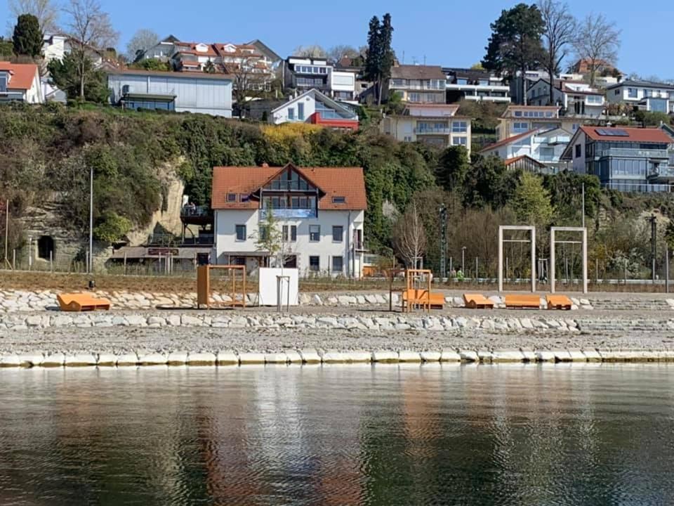 a view of a city from the water at Gästehaus zum Felsen in Überlingen