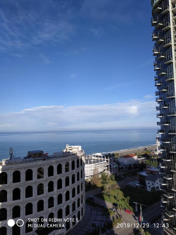 a view of the ocean from a building at Batumi - Orbi Sea Tower & Residence in Batumi