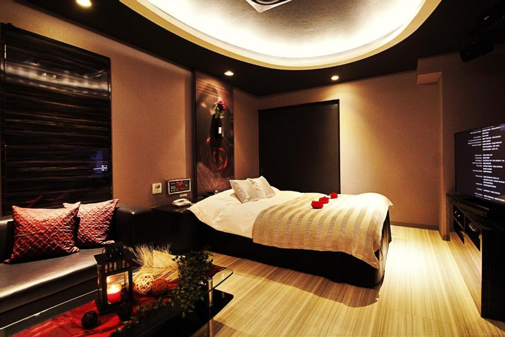 Postel nebo postele na pokoji v ubytování HOTEL O2 -Adult Only-