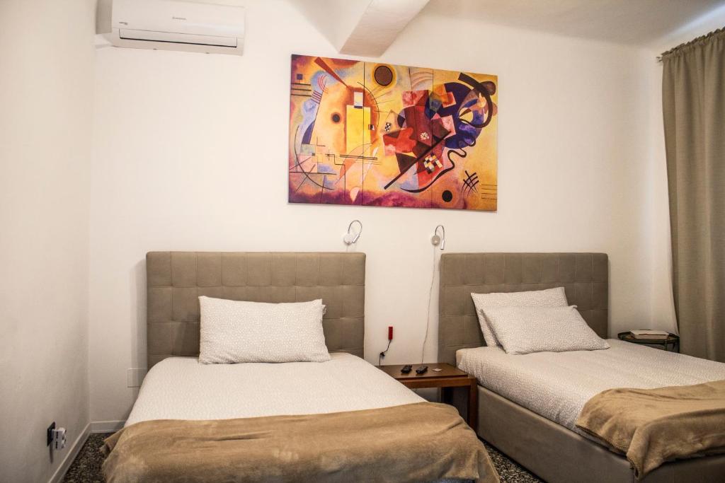 Postel nebo postele na pokoji v ubytování Rho-Fiera - Appartamento in antica cascina