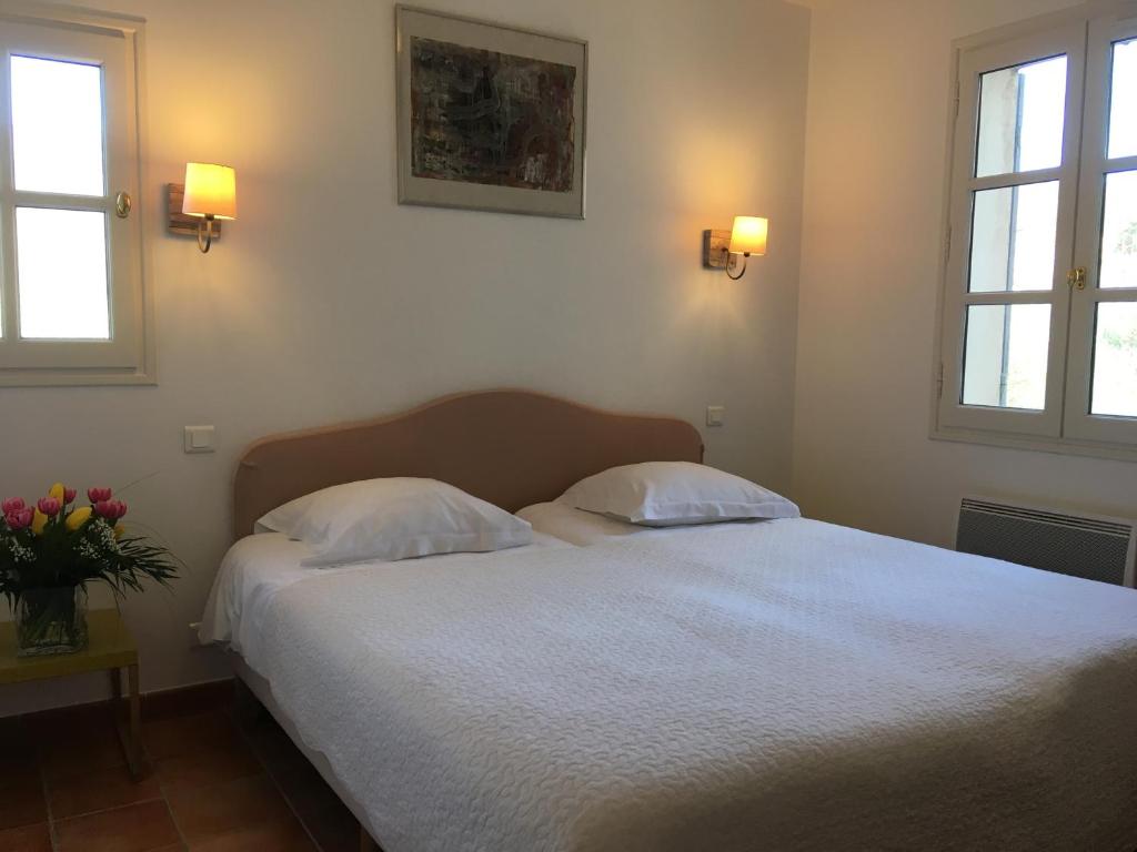Postel nebo postele na pokoji v ubytování La Garance
