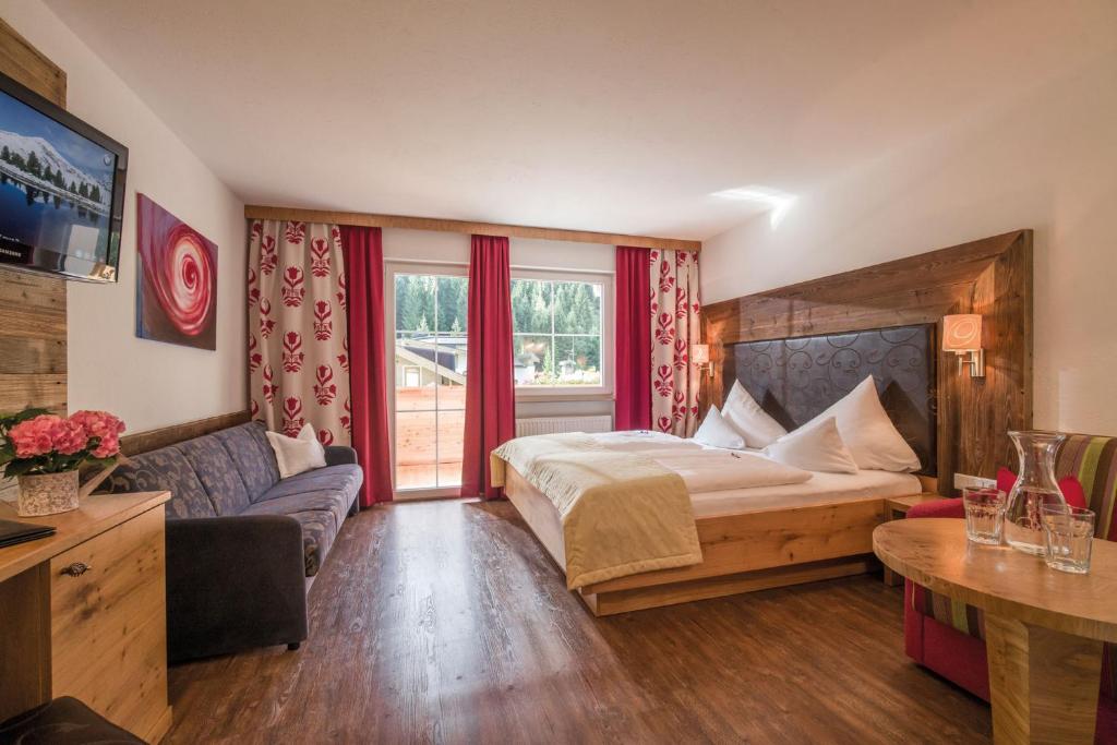 Postel nebo postele na pokoji v ubytování Hotel Maria Theresia