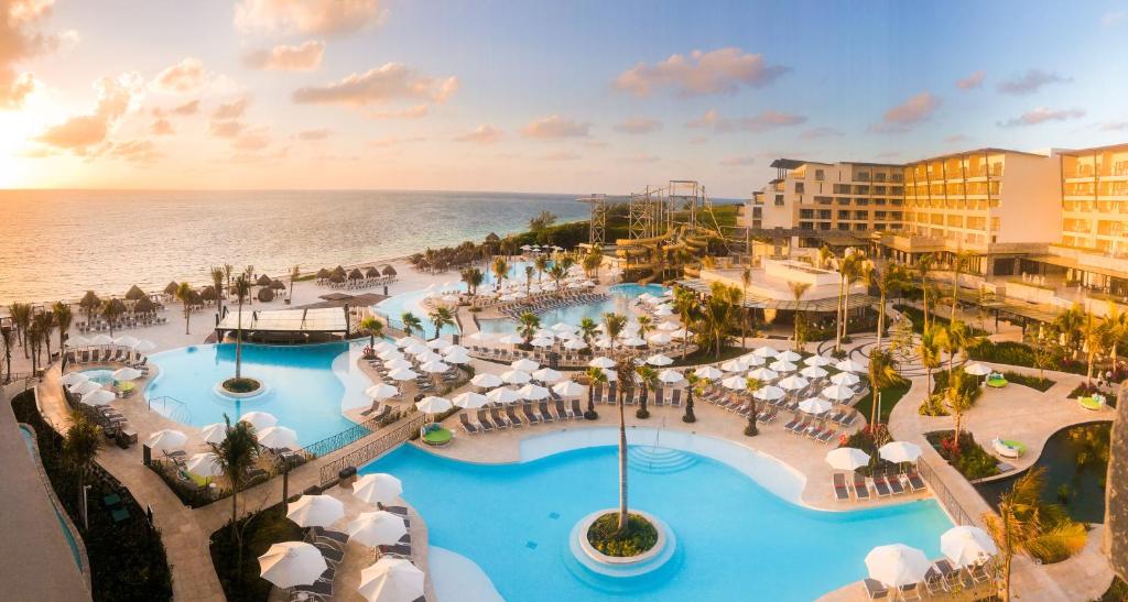 an aerial view of a resort with a pool at Dreams Natura Resort & Spa - All Inclusive in Puerto Morelos