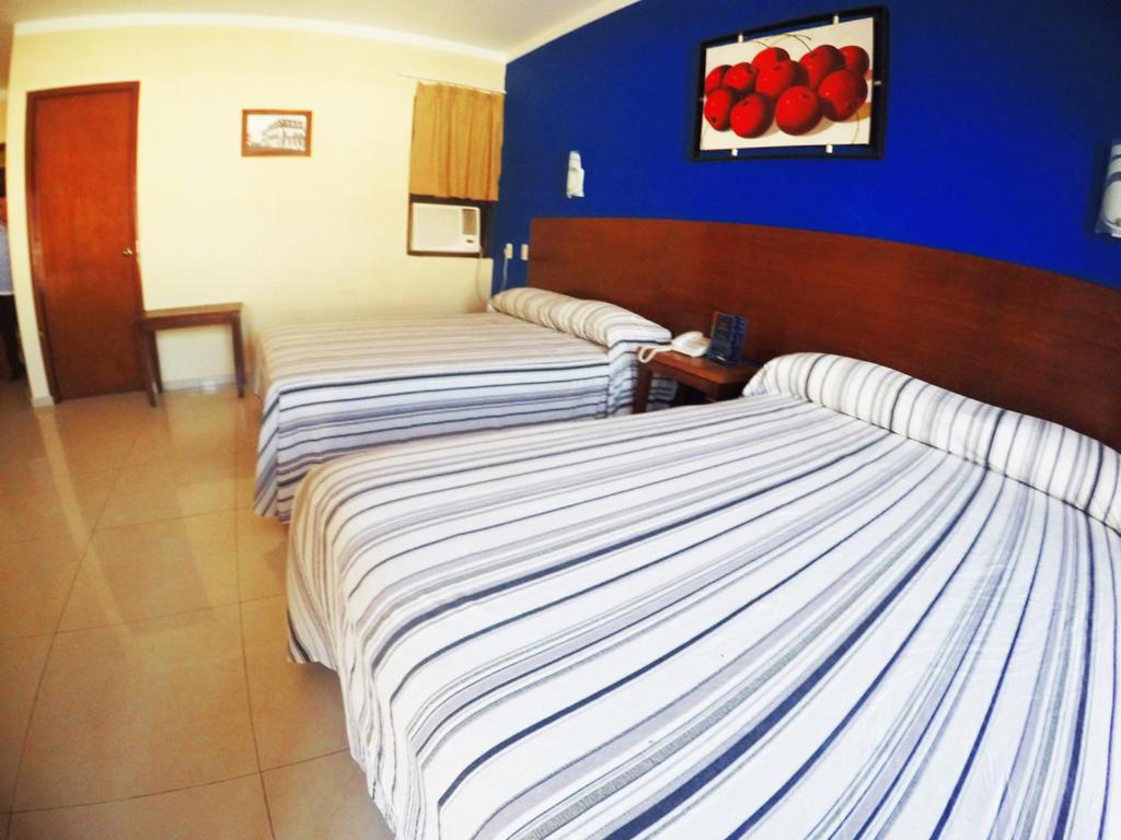 Postel nebo postele na pokoji v ubytování Hotel Oriente