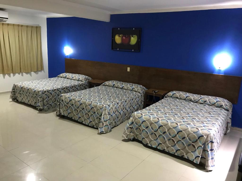 Postel nebo postele na pokoji v ubytování Hotel Oriente