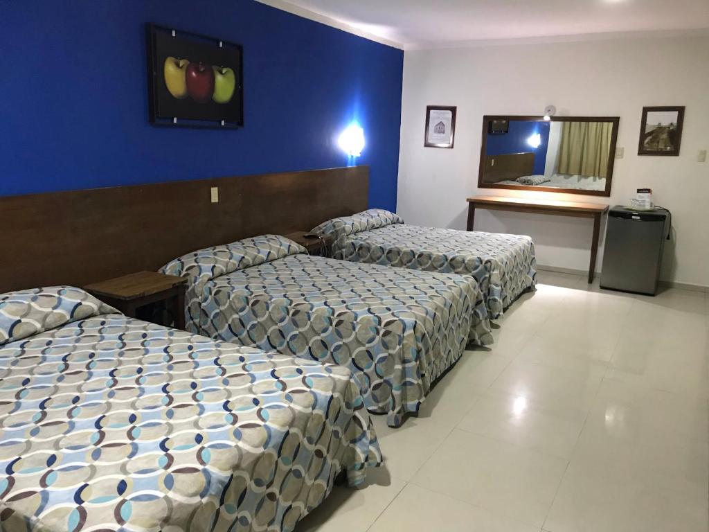 Postel nebo postele na pokoji v ubytování Hotel Oriente