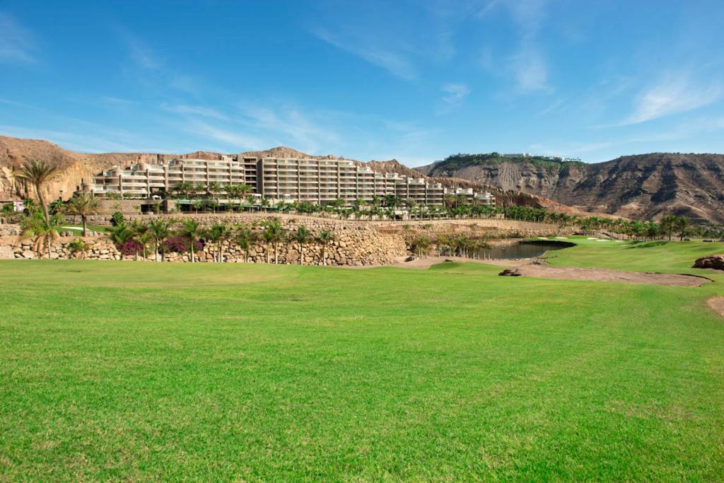 a golf course with a view of a resort at Anfi del Mar Tauro Golf 2 Emerald Club in Mogán