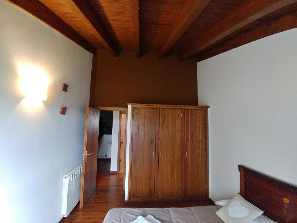 Postel nebo postele na pokoji v ubytování CasaCampelles I - Vall de Núria - Ripollès