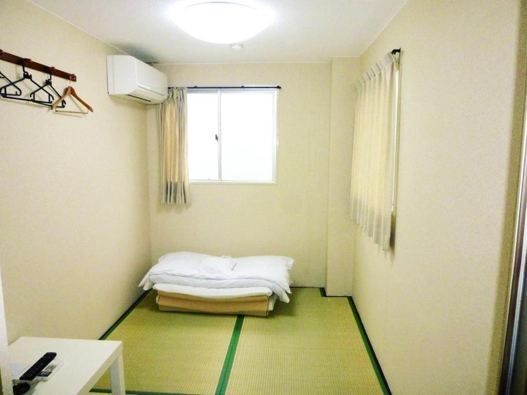 Postel nebo postele na pokoji v ubytování Hotel Lucky