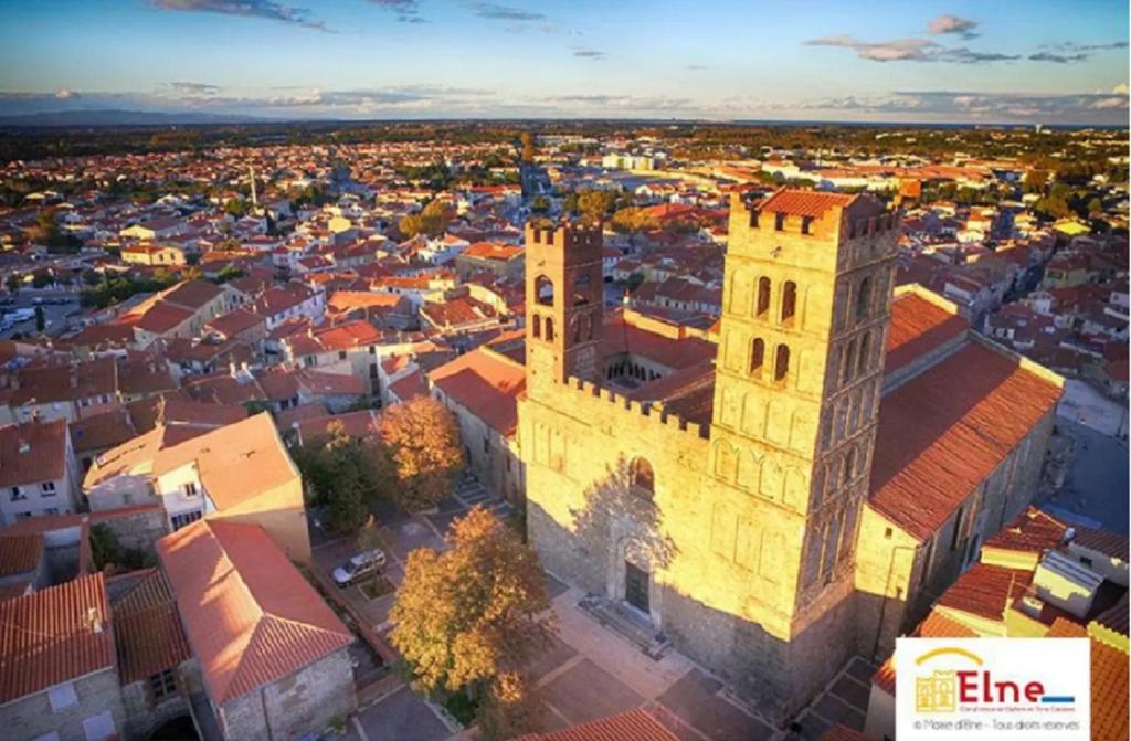 an aerial view of a city with a building at Maison au pied de la cathédrale in Elne