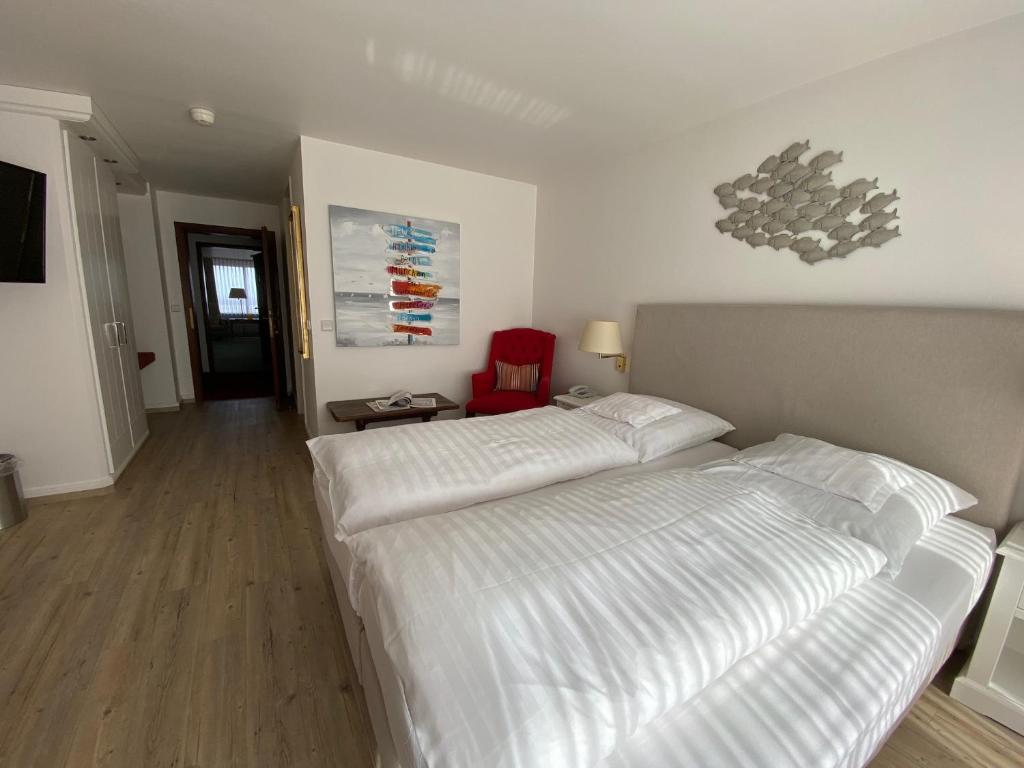Postel nebo postele na pokoji v ubytování Hotel Wünschmann