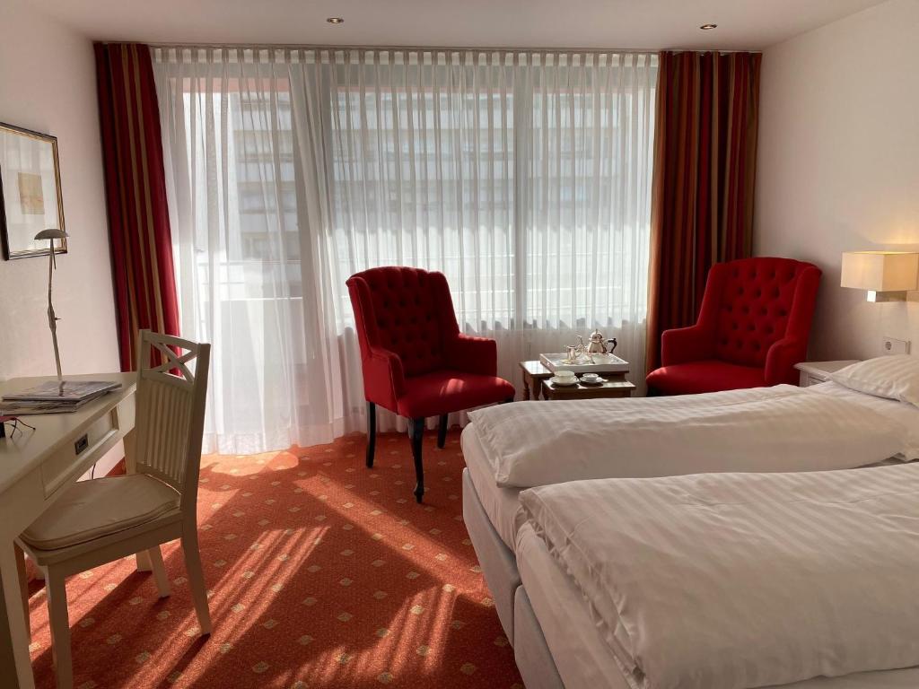 Postel nebo postele na pokoji v ubytování Hotel Wünschmann