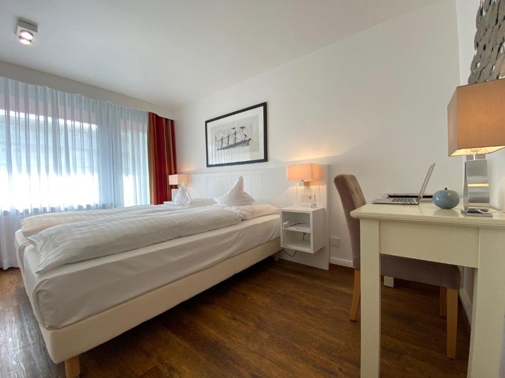 Postel nebo postele na pokoji v ubytování Hotel Wünschmann