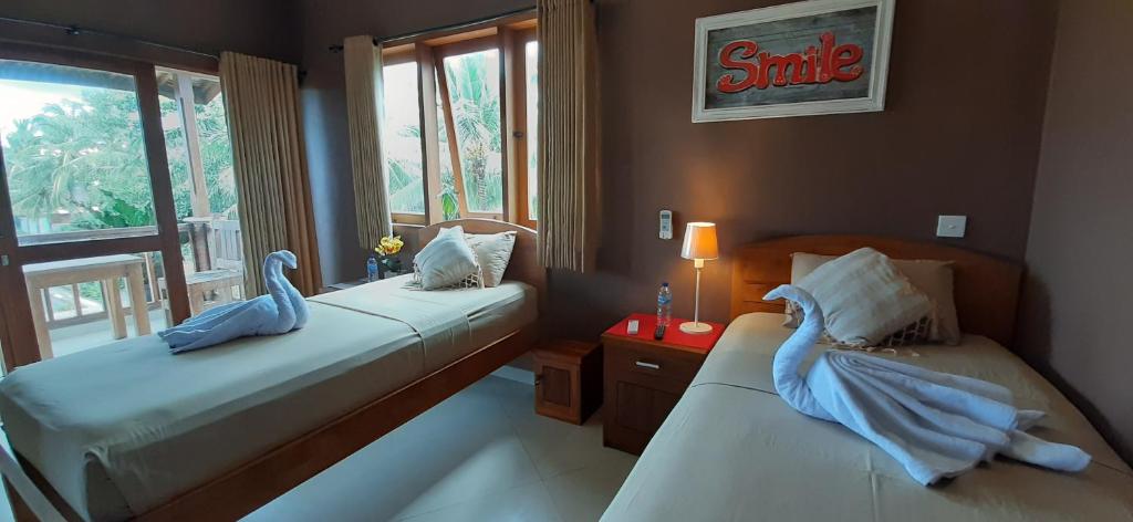 Postel nebo postele na pokoji v ubytování The point surfcamp Bali