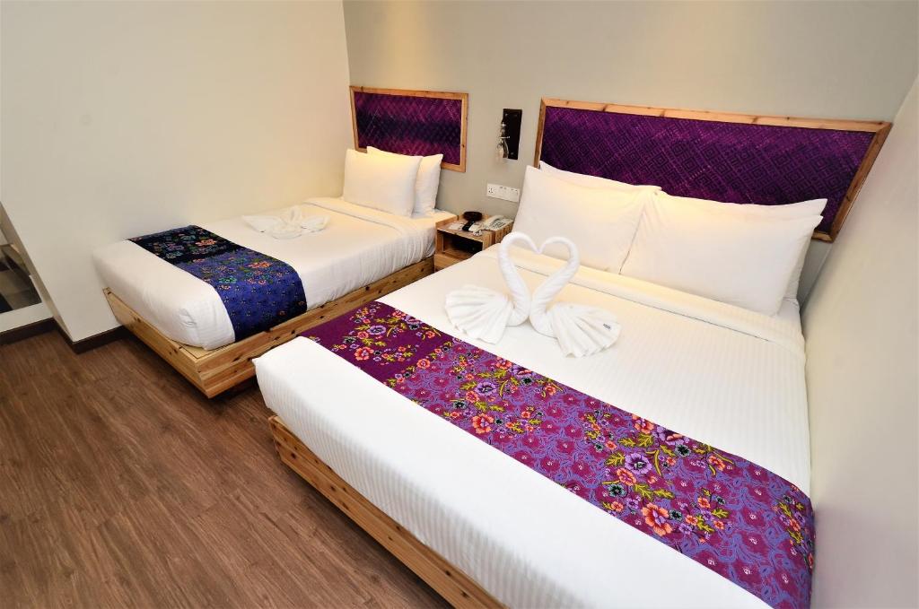 Postel nebo postele na pokoji v ubytování Artisan Eco Hotel