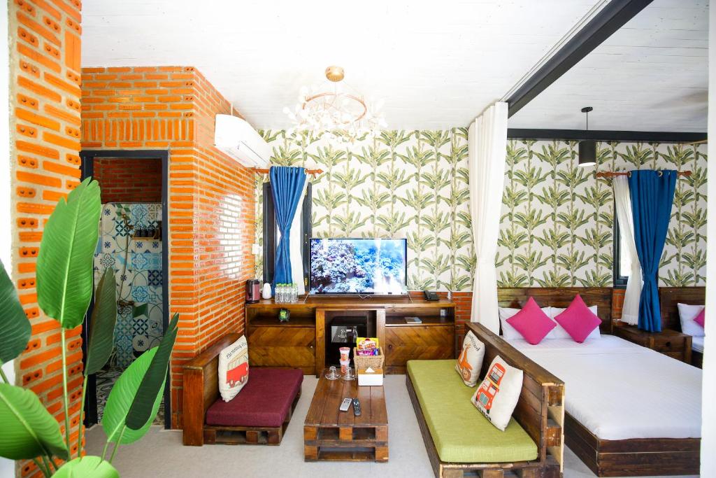 Postel nebo postele na pokoji v ubytování Long Hải Channel Beach Resort