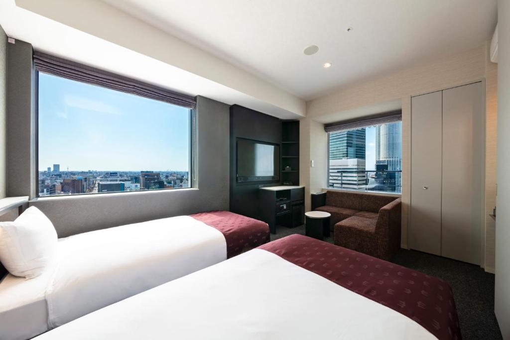三交インGrande名古屋 -HOTEL & SPA-にあるベッド