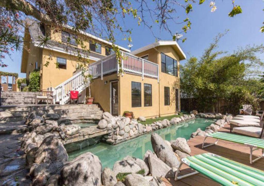 a house with a swimming pool in front of a house at Lg BEACH Home, POOL, Hot Tub, Close to Beaches & Downtown El Segundo Beach in El Segundo