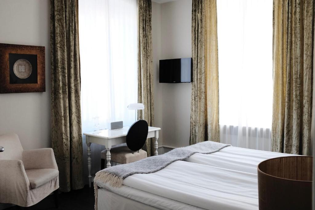 Postel nebo postele na pokoji v ubytování Kalk Hotel