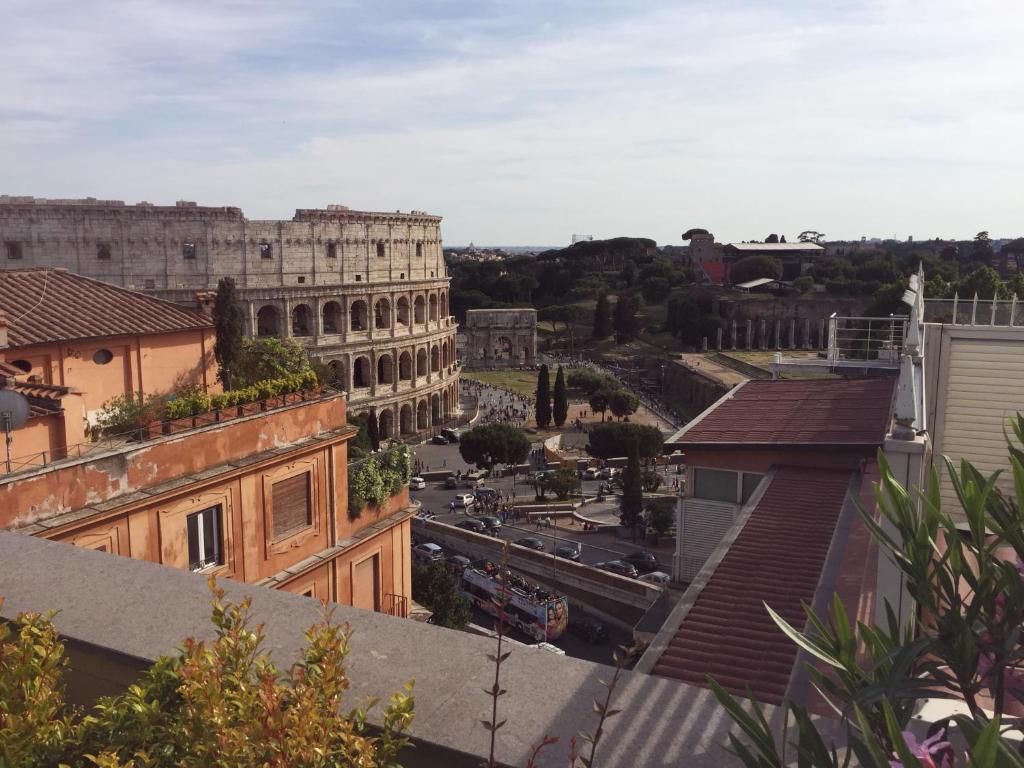 a view of theatican from the roofs of buildings at SUPERATTICO SUL COLOSSEO in Rome