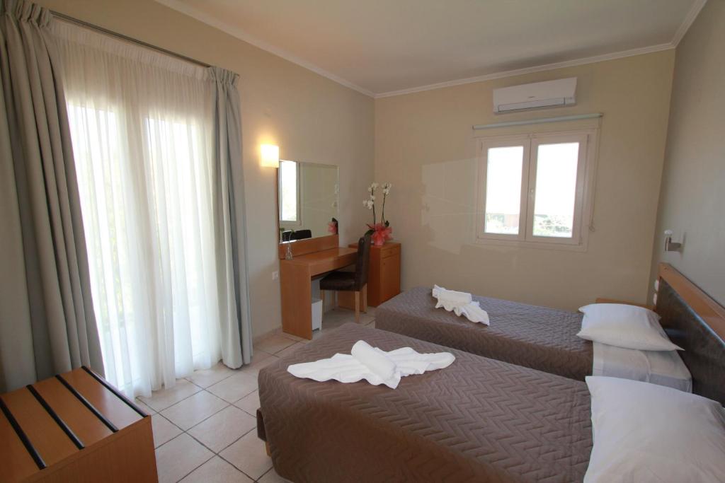 Postel nebo postele na pokoji v ubytování Cosmos Hotel