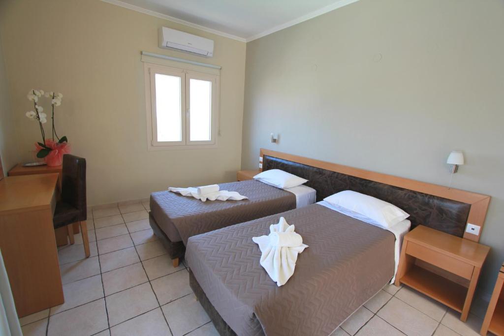 Postel nebo postele na pokoji v ubytování Cosmos Hotel