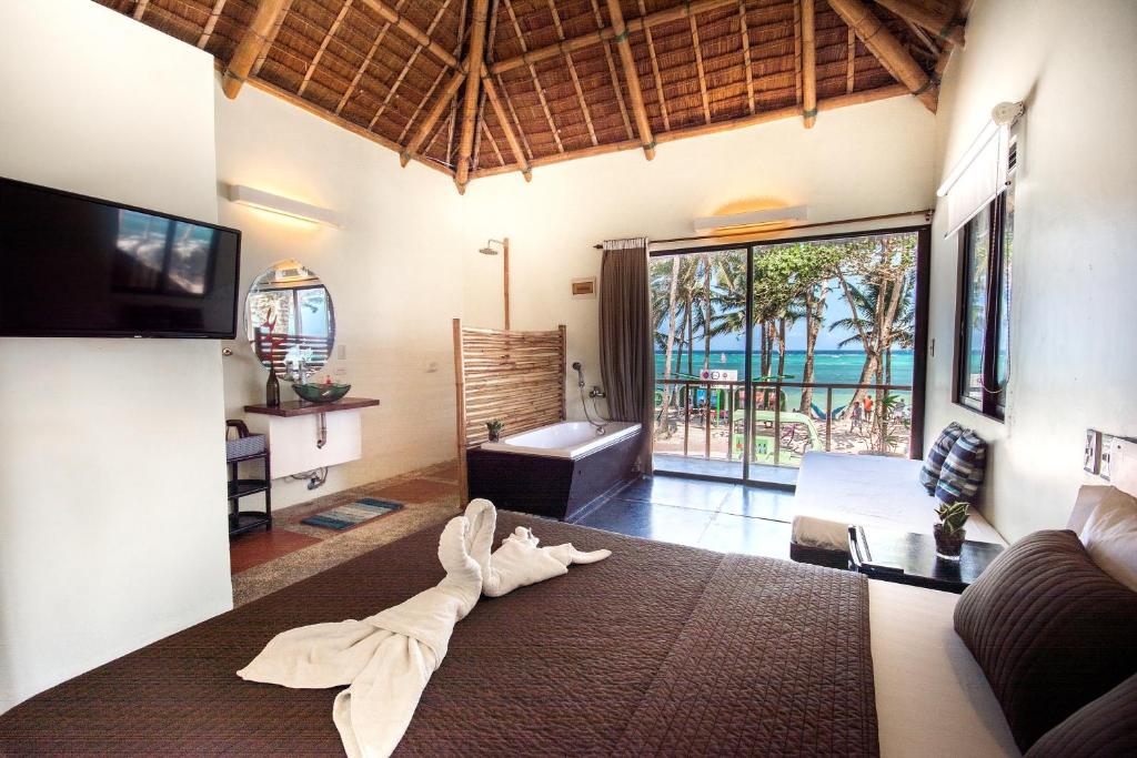 a living room with a towel laying on the floor at Hangin Kite Resort in Boracay