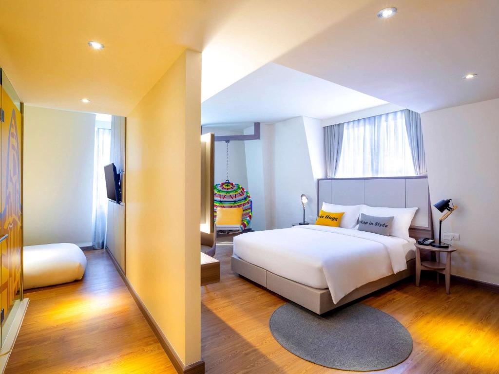 Postel nebo postele na pokoji v ubytování ibis Styles Siem Reap
