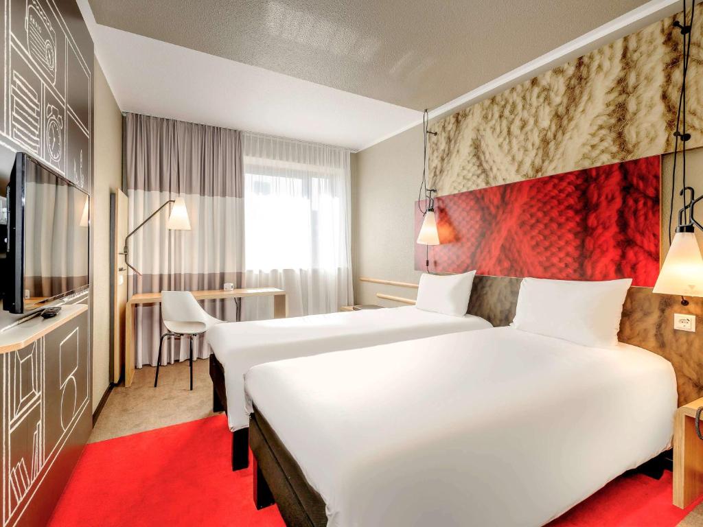 Postel nebo postele na pokoji v ubytování ibis Berlin Mitte