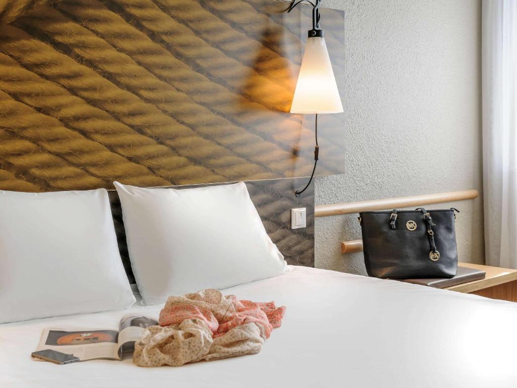 Postel nebo postele na pokoji v ubytování ibis Berlin Mitte