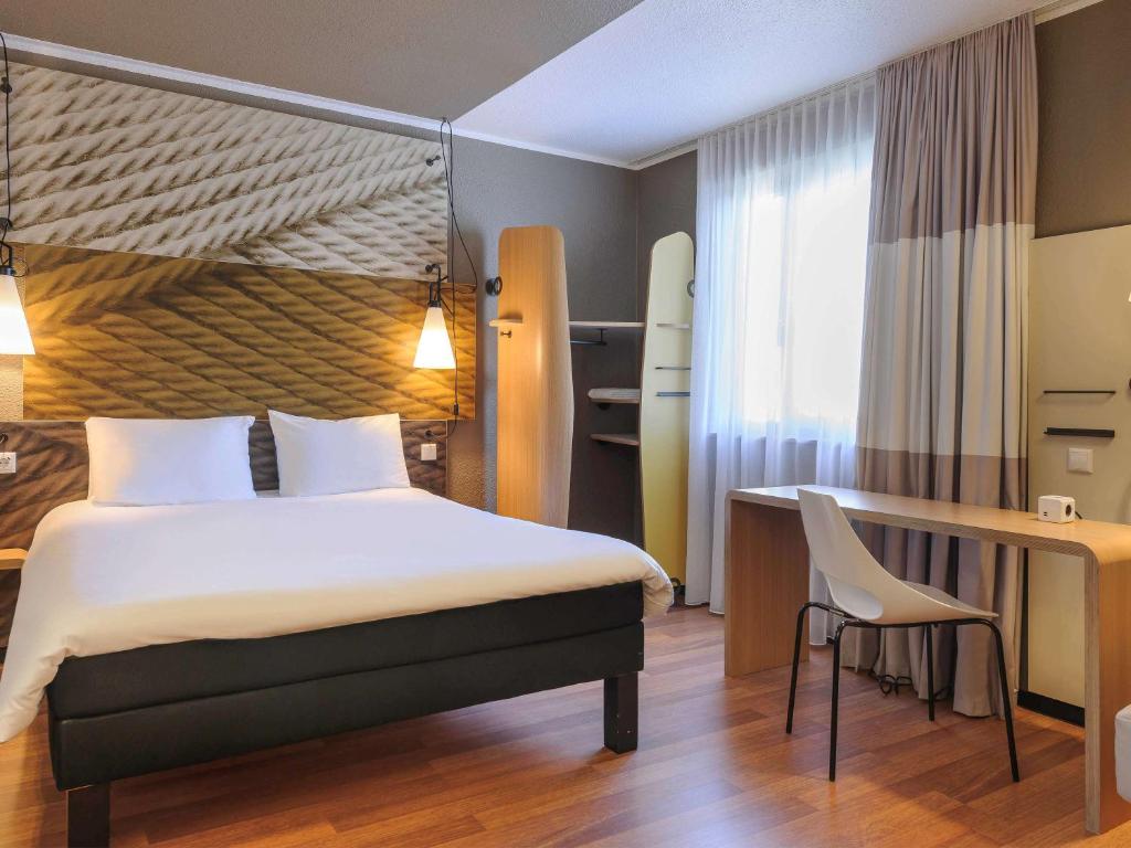 Postel nebo postele na pokoji v ubytování ibis Berlin Mitte