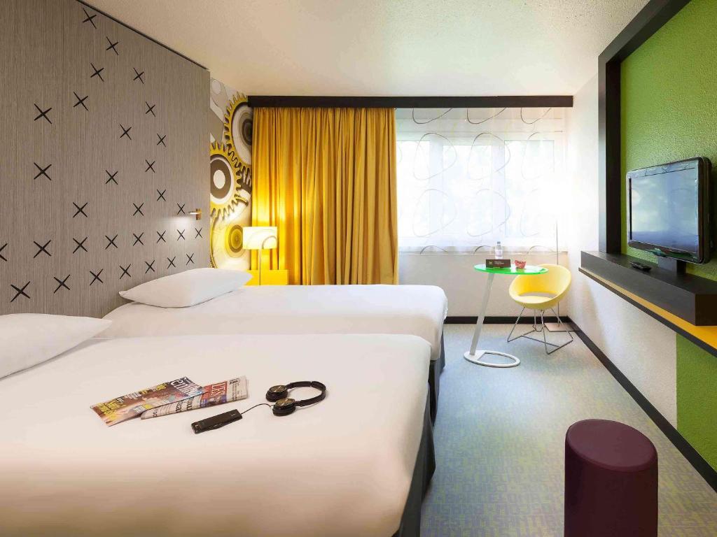 Postel nebo postele na pokoji v ubytování ibis Styles Besançon