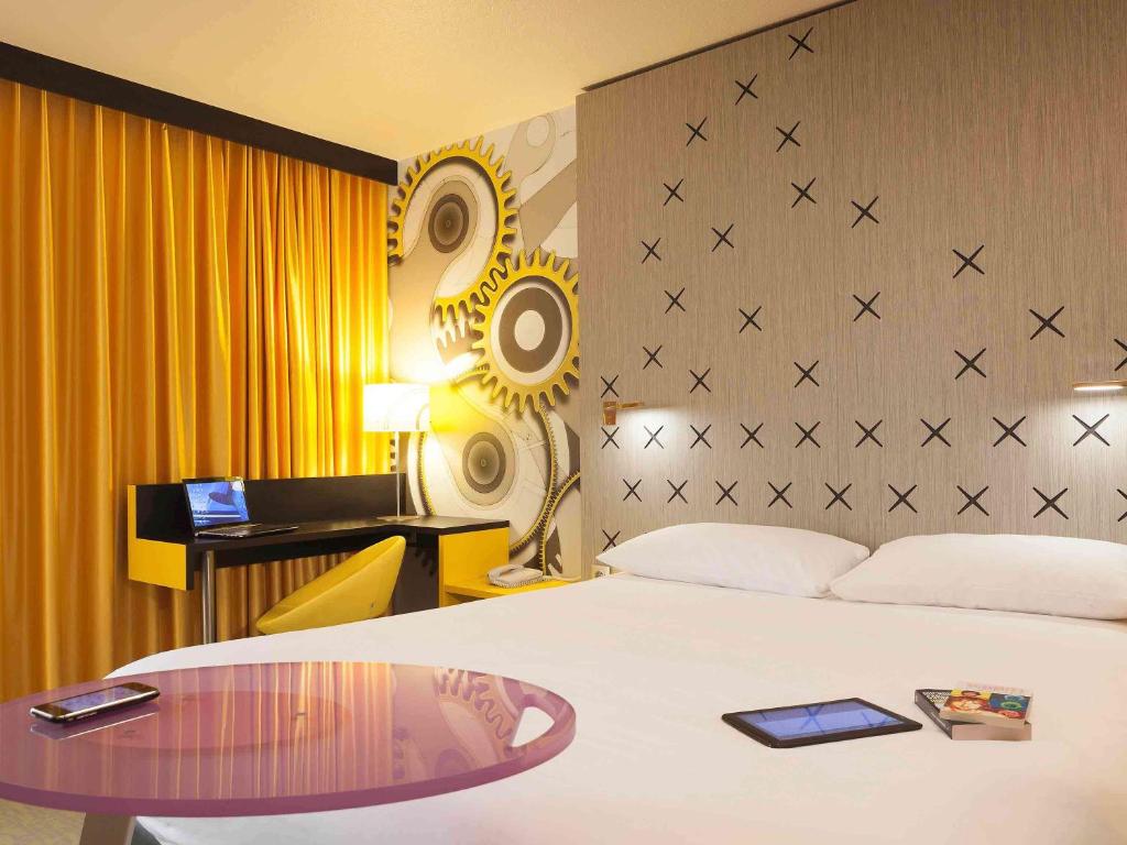 Postel nebo postele na pokoji v ubytování ibis Styles Besançon
