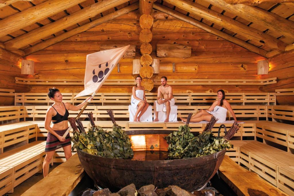 a group of people in a sauna at Hotel Claro Garni in Eitting