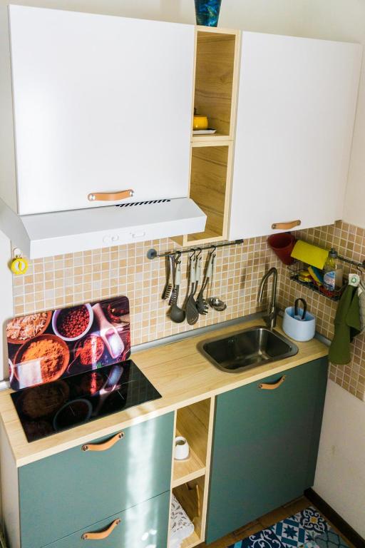 Kuchyň nebo kuchyňský kout v ubytování Appartamento Palma