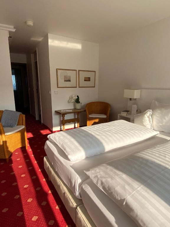 Postel nebo postele na pokoji v ubytování Hotel Wünschmann