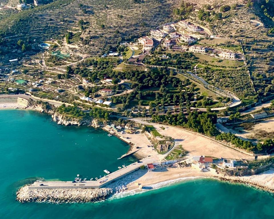 an aerial view of a beach and the ocean at Holiday Lodge al Porto in Mattinata