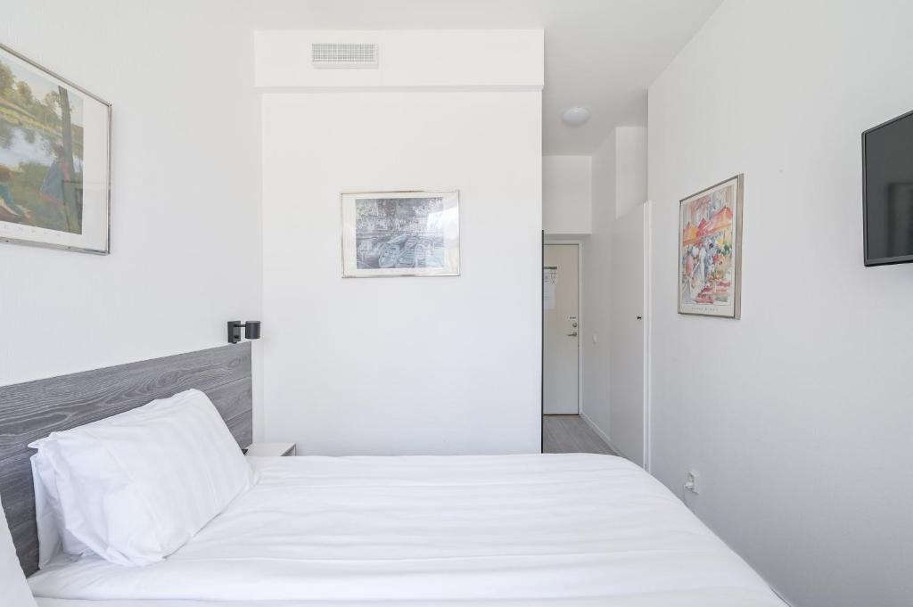 Postel nebo postele na pokoji v ubytování Hotel Bema