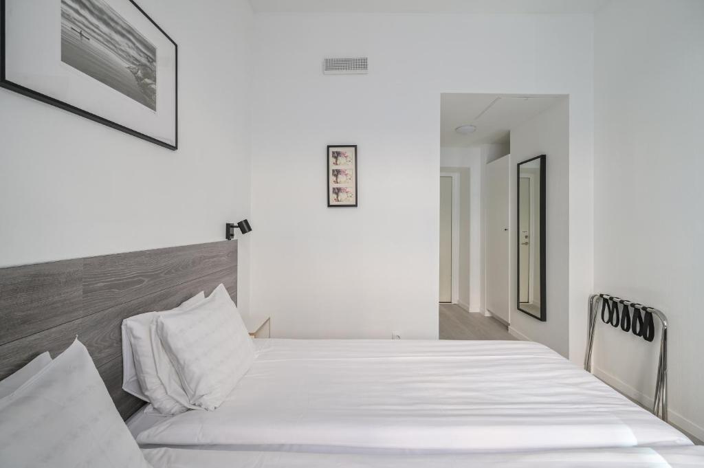 Postel nebo postele na pokoji v ubytování Hotel Bema