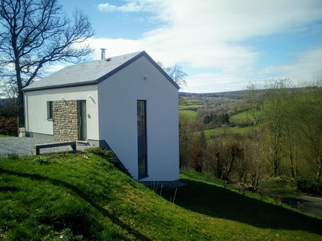 a small white chapel on a grassy hill at Lessilou in Mormont