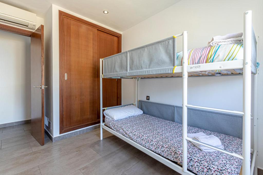 A bed or beds in a room at Townhouse Calvari By homevillas360