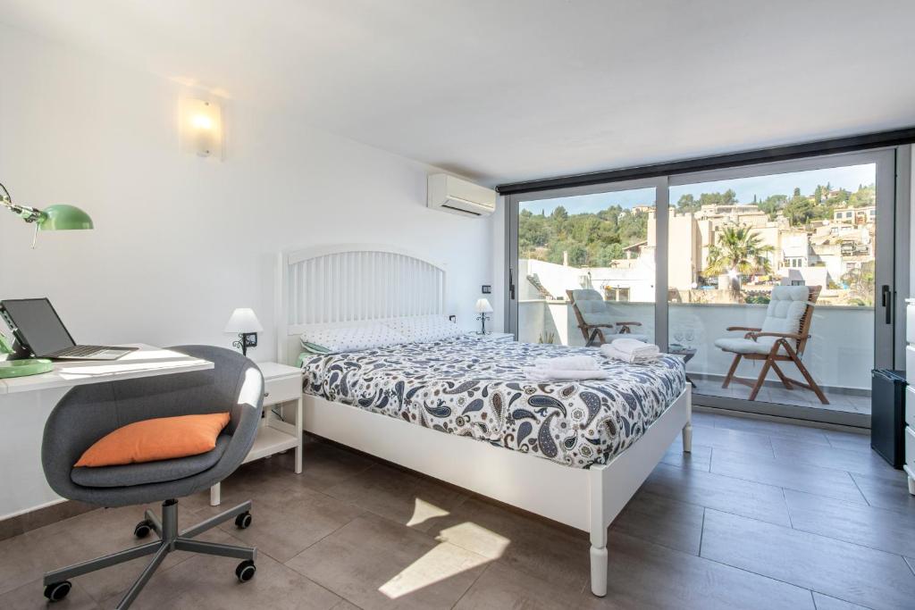 A bed or beds in a room at Townhouse Calvari By homevillas360
