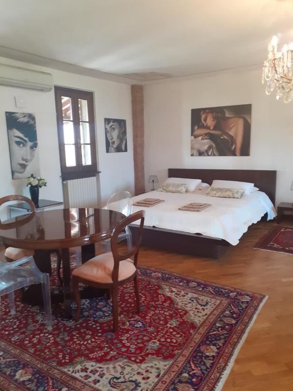 Postel nebo postele na pokoji v ubytování B&B Cascina in Franciacorta